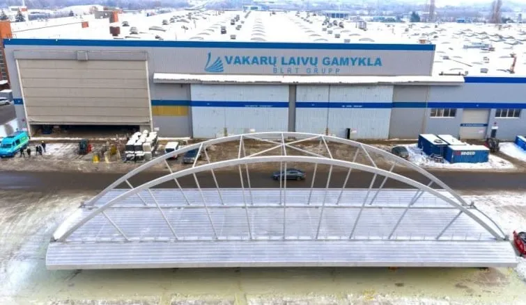 Härnön duplex stainless steel bridge fabricated by Western Technological Solutions, positioned in front of the workshop at the sea pier, featuring a large arched duplex steel framework 